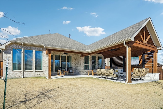 rear view of property featuring an outdoor living space, a lawn, ceiling fan, and a patio area