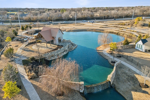 view of swimming pool with a water view