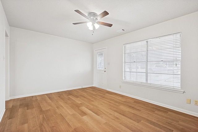 empty room featuring light hardwood / wood-style floors and ceiling fan