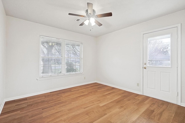 foyer entrance with plenty of natural light, hardwood / wood-style floors, and ceiling fan