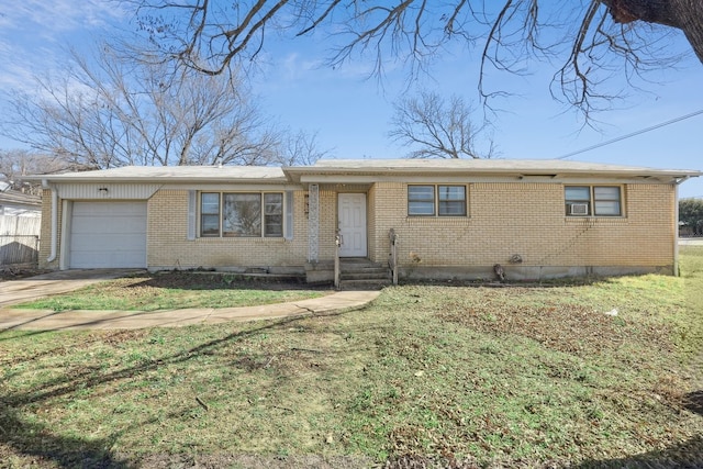 ranch-style home with a garage and a front yard