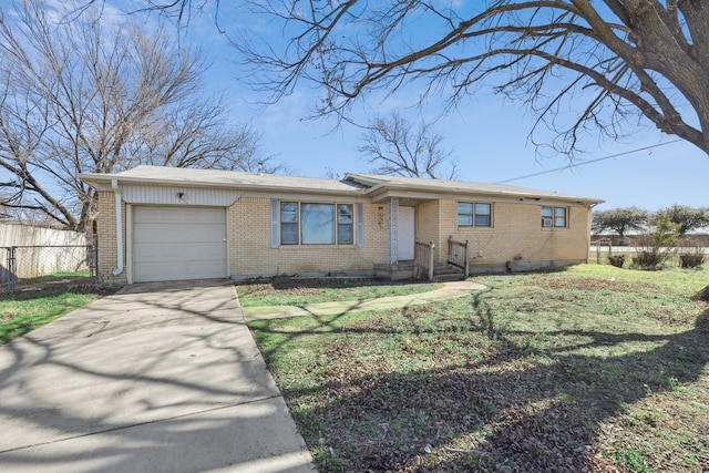 ranch-style home with a garage and a front lawn