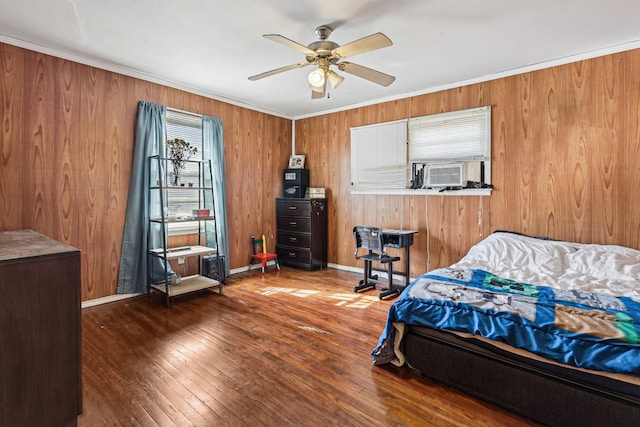 bedroom featuring cooling unit, crown molding, dark wood-type flooring, and ceiling fan