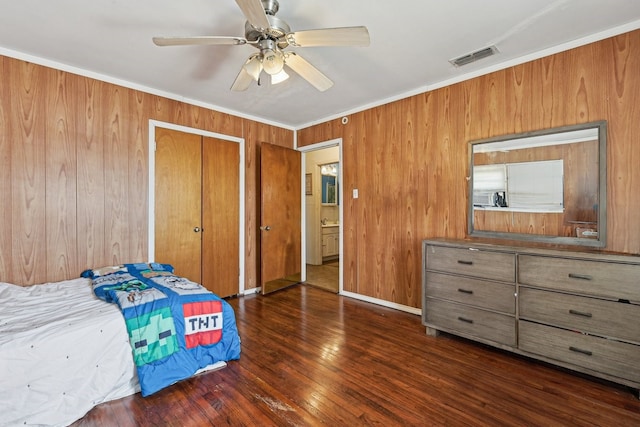 bedroom featuring crown molding, ceiling fan, and dark hardwood / wood-style floors