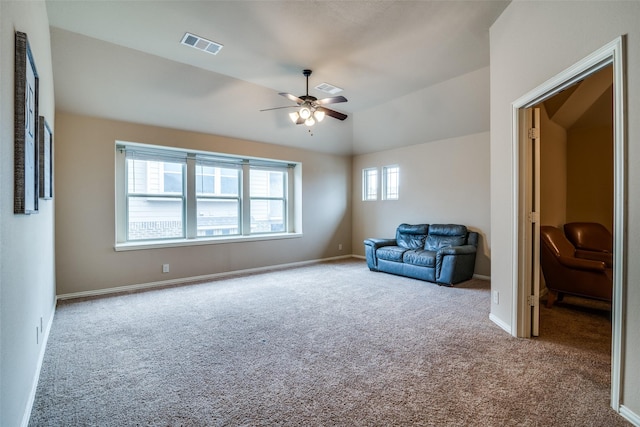 unfurnished room with lofted ceiling, carpet floors, and ceiling fan