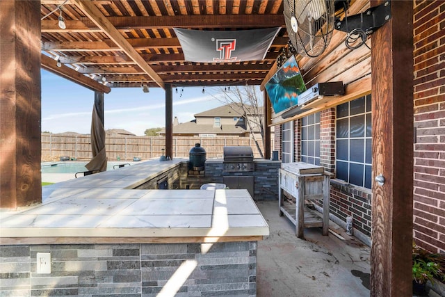 view of patio with area for grilling and grilling area