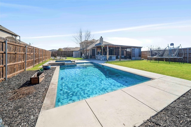 view of pool featuring an in ground hot tub, a yard, a trampoline, and a patio area