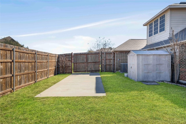 view of yard with a storage shed, central AC unit, and a patio area