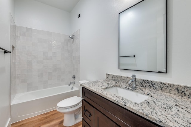 2130 Roanoke Ave, Dallas, TX 75235 - full bathroom featuring tiled shower / bath, wood-type flooring, toilet, and vanity
