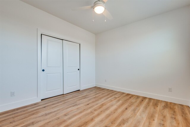 2130 Roanoke Ave, Dallas, TX 75235 - unfurnished bedroom with ceiling fan, light wood-type flooring, and a closet