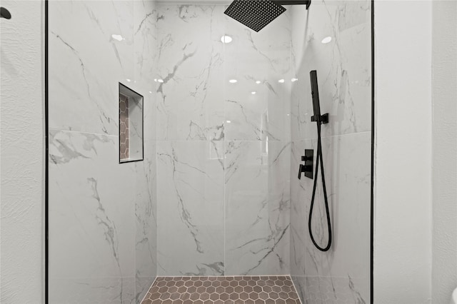 bathroom featuring tiled shower