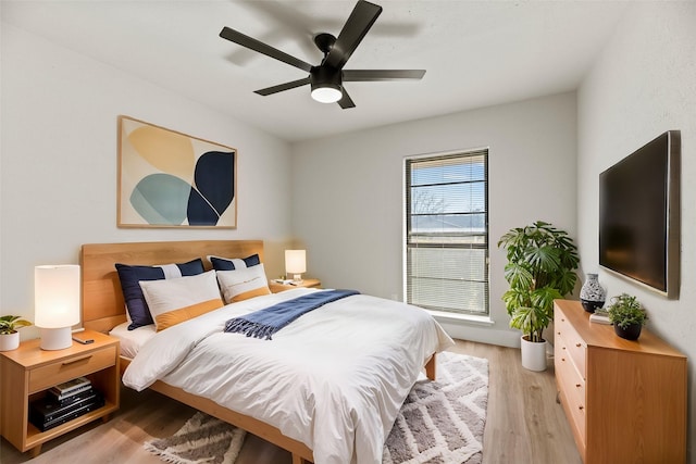 bedroom featuring ceiling fan and light hardwood / wood-style floors