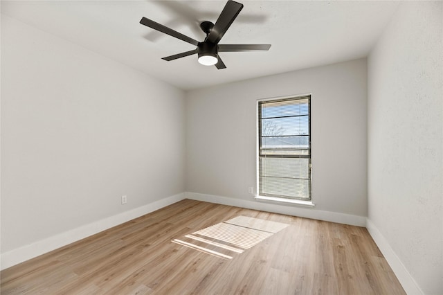 unfurnished room featuring ceiling fan and light hardwood / wood-style flooring