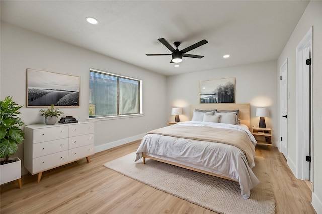 bedroom with ceiling fan and light hardwood / wood-style flooring