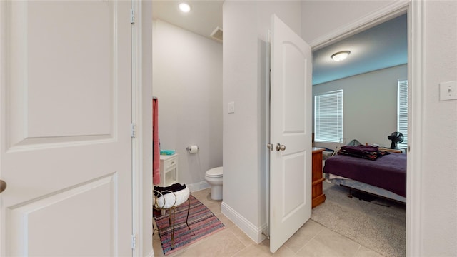 bathroom featuring tile patterned floors and toilet