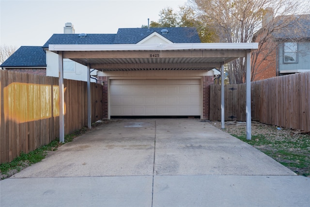 garage featuring a carport