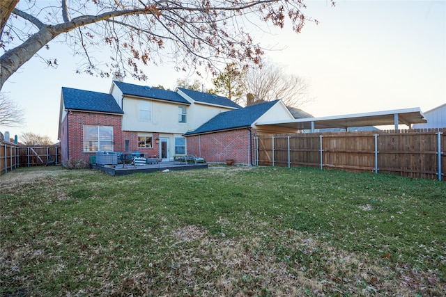 back of house featuring a yard