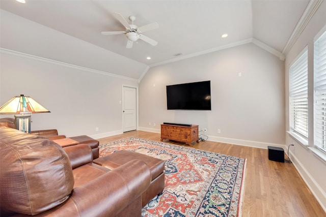 living room featuring crown molding, ceiling fan, vaulted ceiling, and light hardwood / wood-style flooring