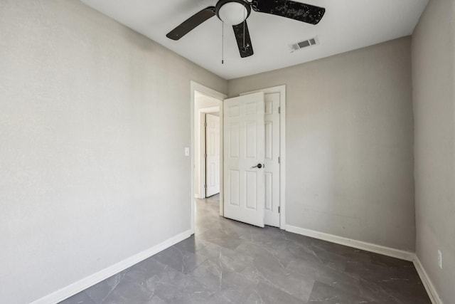 spare room with ceiling fan