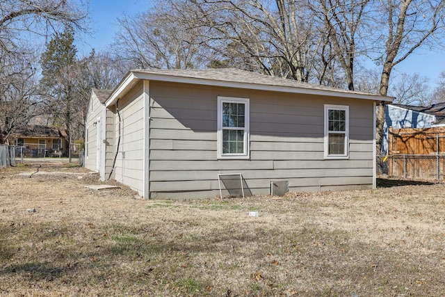 view of side of property with a yard