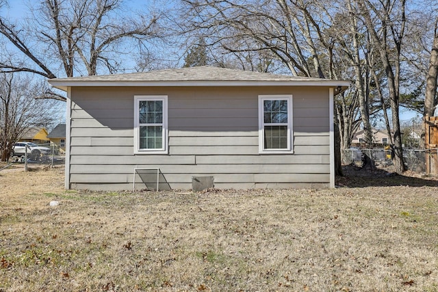 view of side of property with a yard