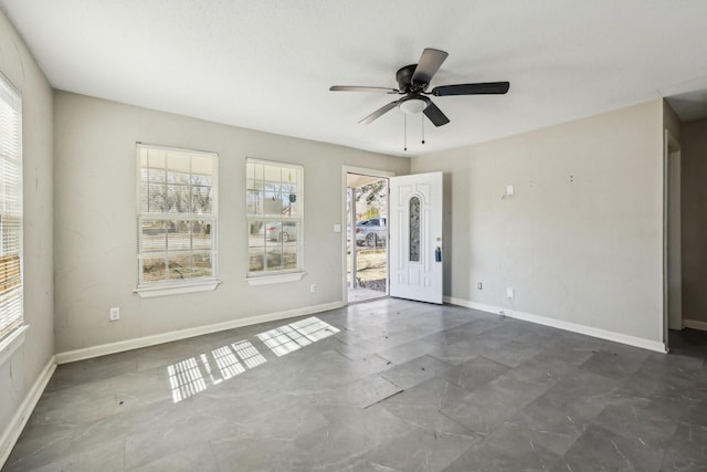 unfurnished room featuring ceiling fan