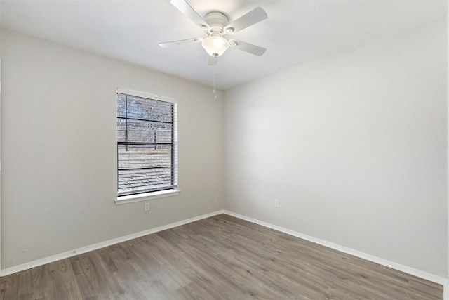 empty room with wood-type flooring and ceiling fan