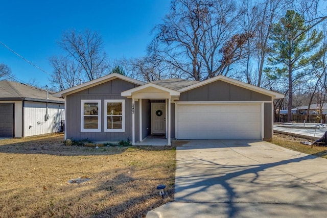 ranch-style house with a garage and a front yard