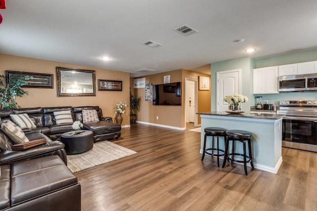 living room with light hardwood / wood-style flooring