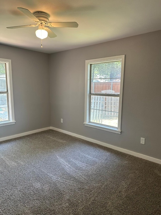 empty room with carpet and ceiling fan