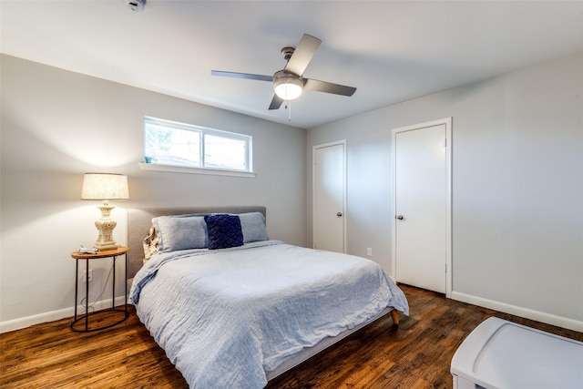 bedroom featuring dark hardwood / wood-style flooring and ceiling fan