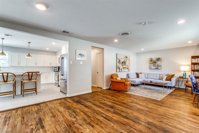 living room with light hardwood / wood-style floors