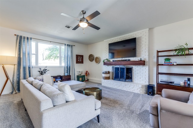 living room with ceiling fan, a fireplace, and carpet flooring