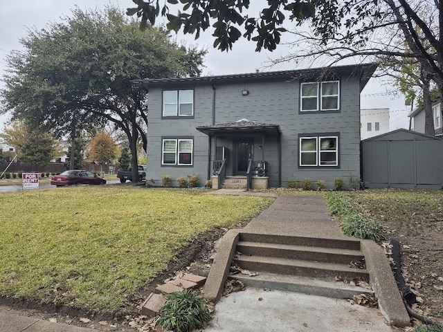 view of front facade with a front yard