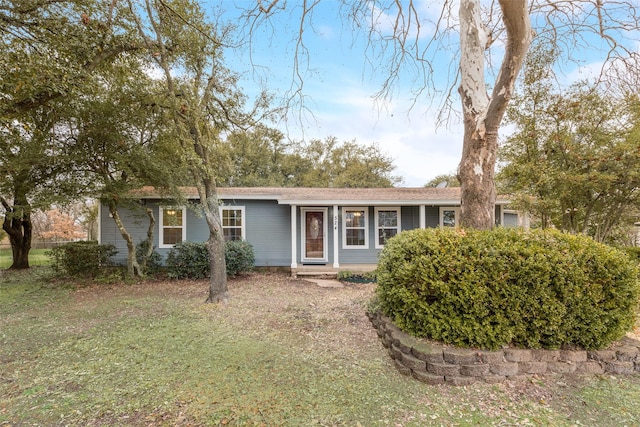 ranch-style home with a front yard