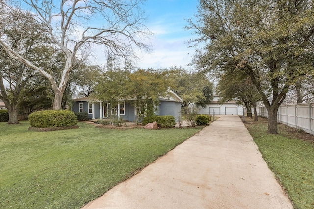 view of front of house with a garage and a front yard