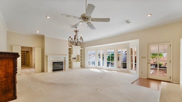 living room with crown molding, ceiling fan with notable chandelier, and light carpet