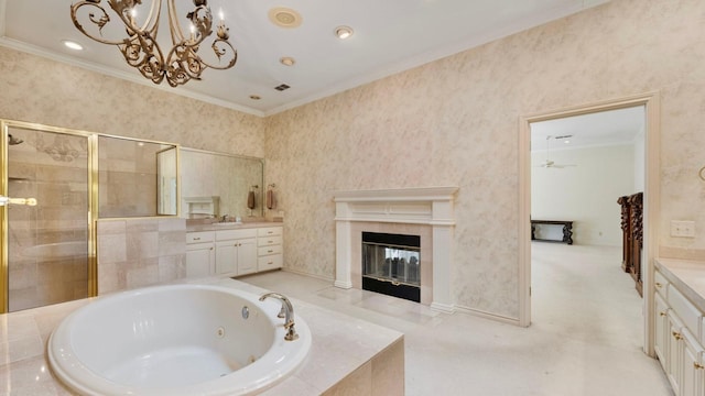 bathroom with a tiled fireplace, crown molding, shower with separate bathtub, and vanity