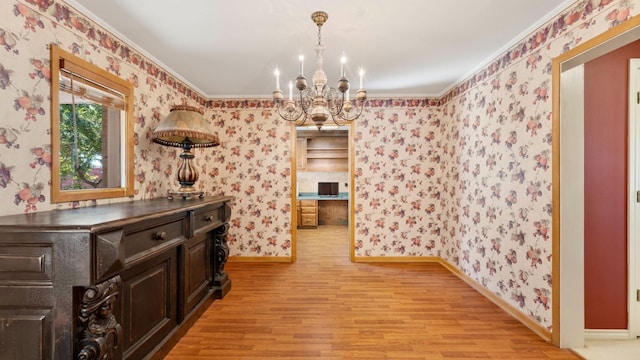 dining space featuring an inviting chandelier and light wood-type flooring