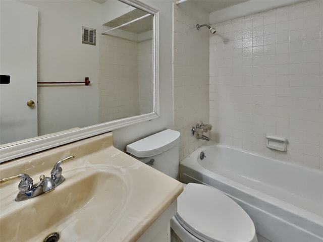 full bathroom with vanity, toilet, and tiled shower / bath