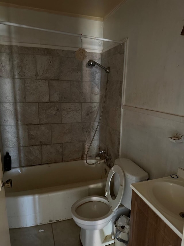 full bathroom featuring vanity, tiled shower / bath combo, tile patterned floors, and toilet