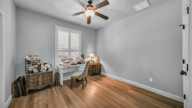 office space featuring ceiling fan and light hardwood / wood-style flooring