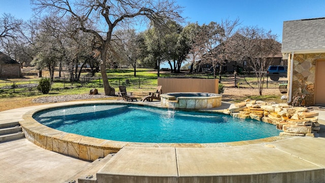 view of swimming pool with an in ground hot tub, pool water feature, and a patio area