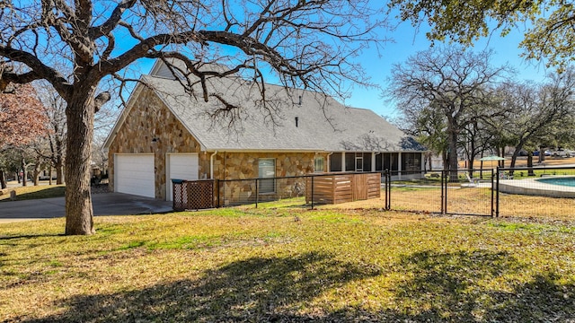 view of side of home with a garage and a lawn