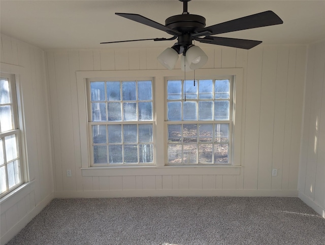 unfurnished room with carpet floors and ceiling fan