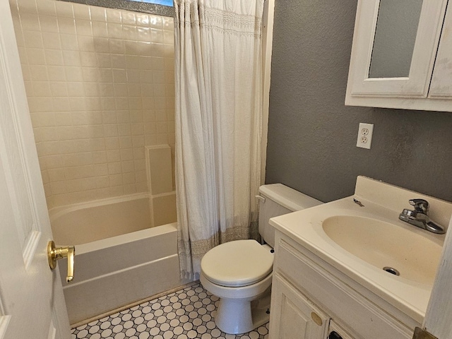 full bathroom with shower / tub combo, vanity, and toilet