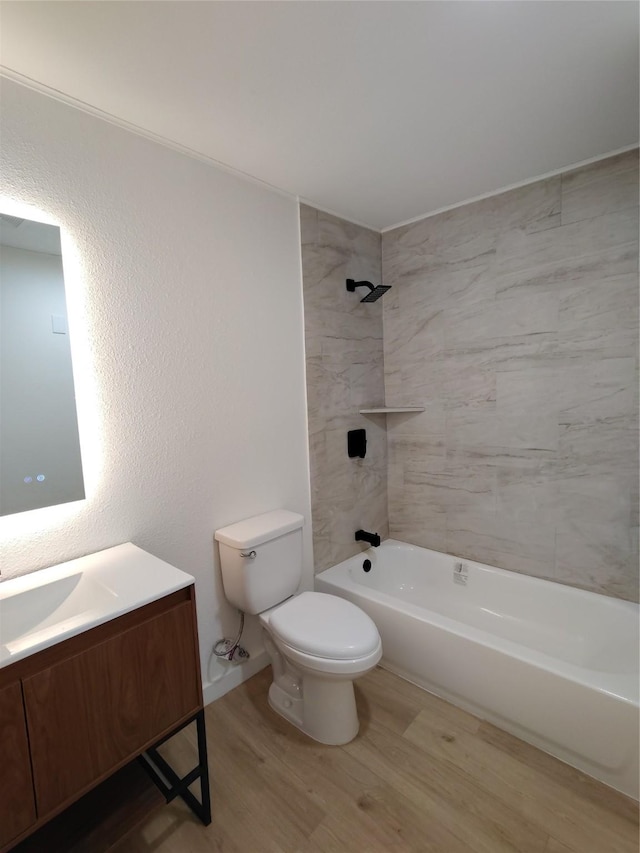 full bath with shower / washtub combination, vanity, toilet, and wood finished floors