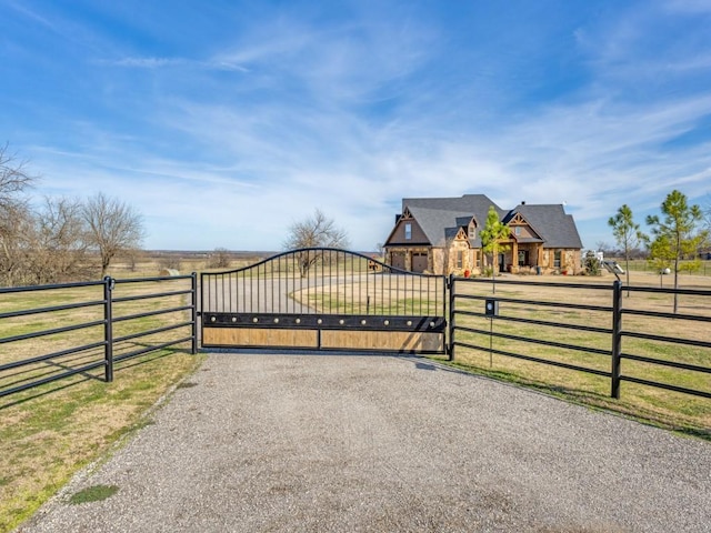 view of gate featuring a rural view