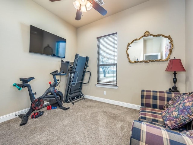 workout room featuring light colored carpet and ceiling fan