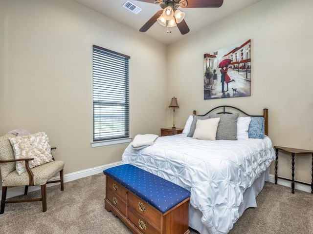 bedroom featuring light colored carpet and ceiling fan